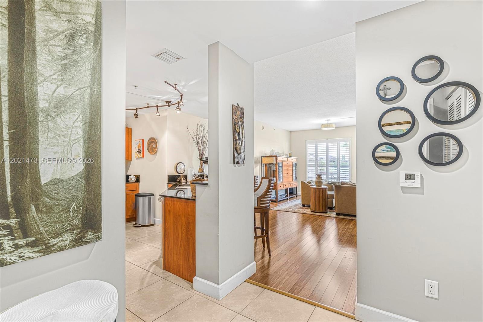 8395 Southwest 73rd Avenue, Unit 710 Miami, FL 33143 - Photo 7 of 32 a view of a living room and hardwood floor