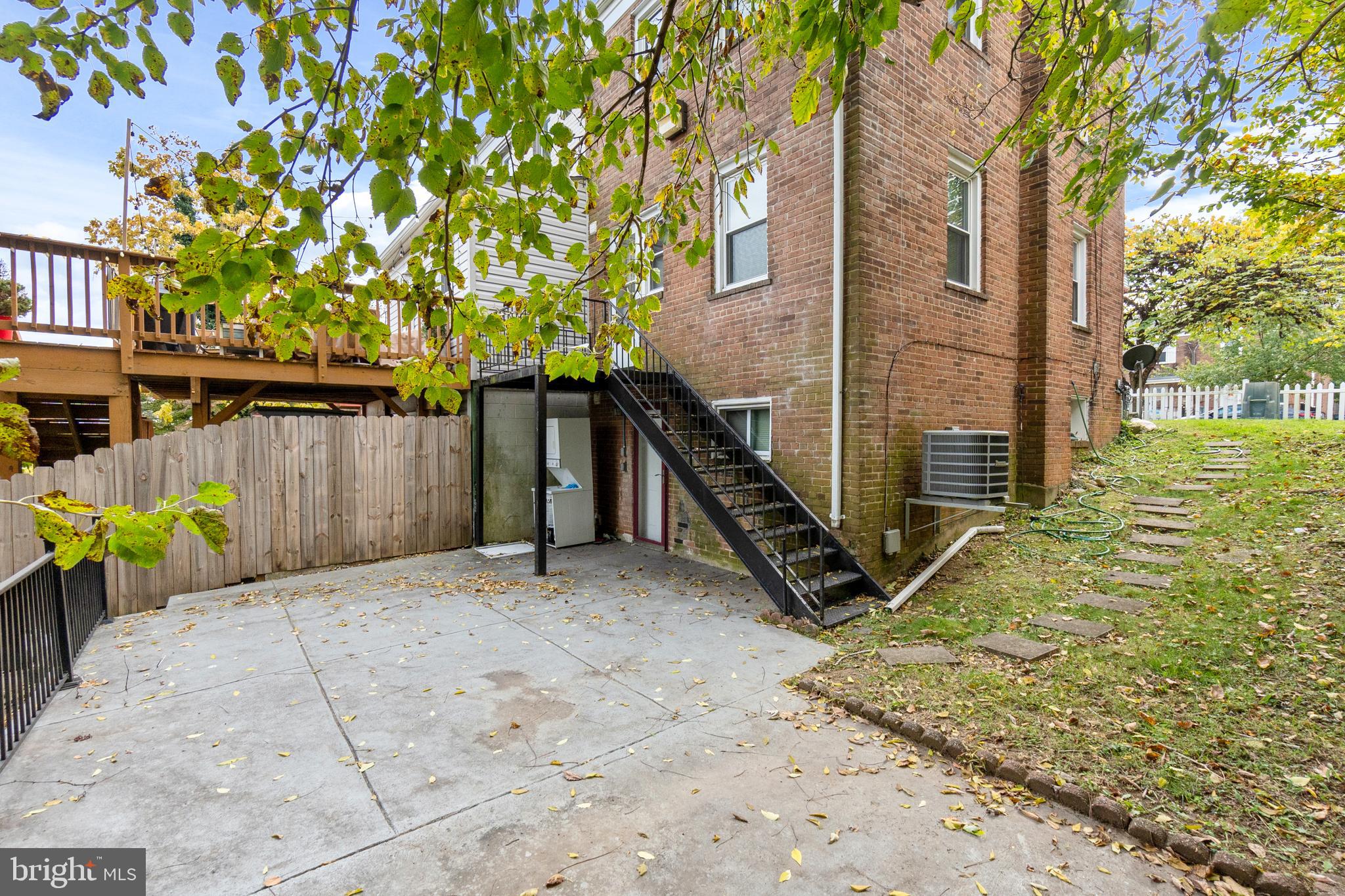 4636 A Street Southeast Washington, DC 20019 - Photo 4 of 4 a backyard of a house with table and chairs