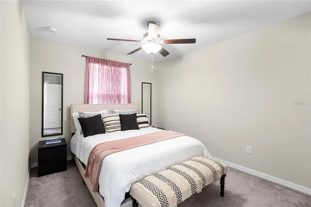 a bedroom with a bed and window