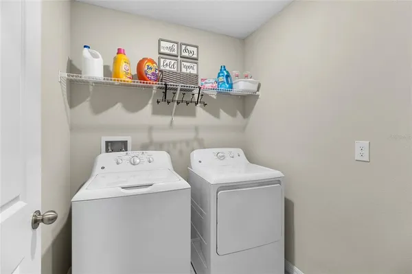 a utility room with dryer and washer
