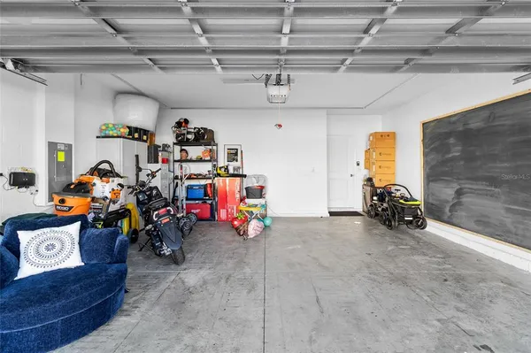 a view of a garage with a bike and car