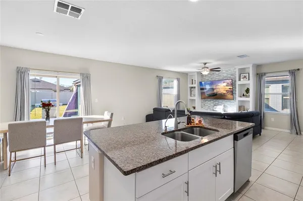 a kitchen with a counter space and breakfast area