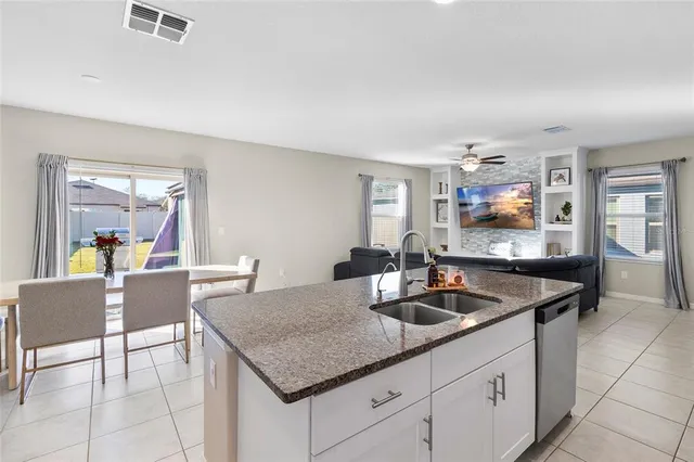 a kitchen with a counter space and breakfast area