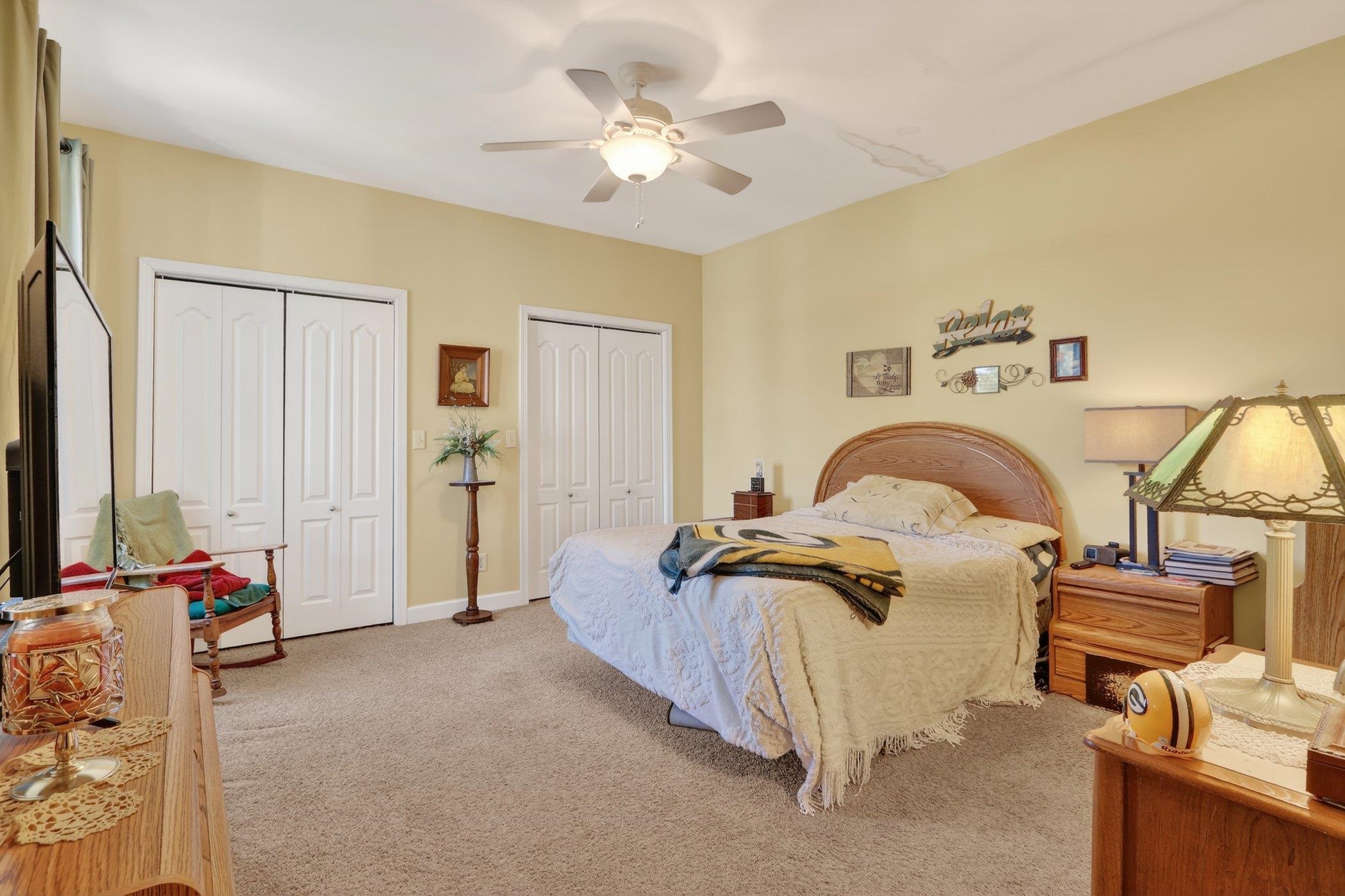 3721 Green Tree Lane DeKalb, IL 60115 - Photo 14 of 20 a bedroom with furniture and a ceiling fan