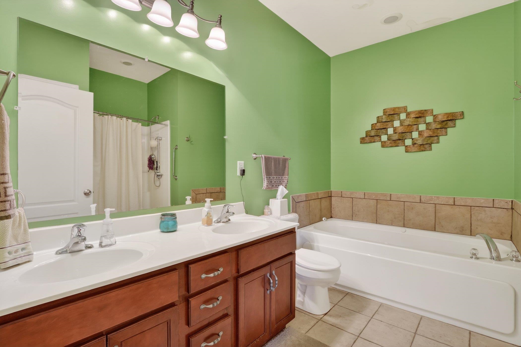 3721 Green Tree Lane DeKalb, IL 60115 - Photo 16 of 20 a bathroom with a double vanity sink mirror and toilet