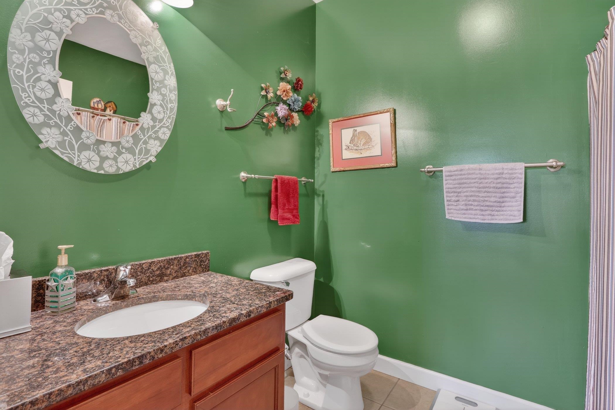3721 Green Tree Lane DeKalb, IL 60115 - Photo 17 of 20 a bathroom with a toilet sink and mirror