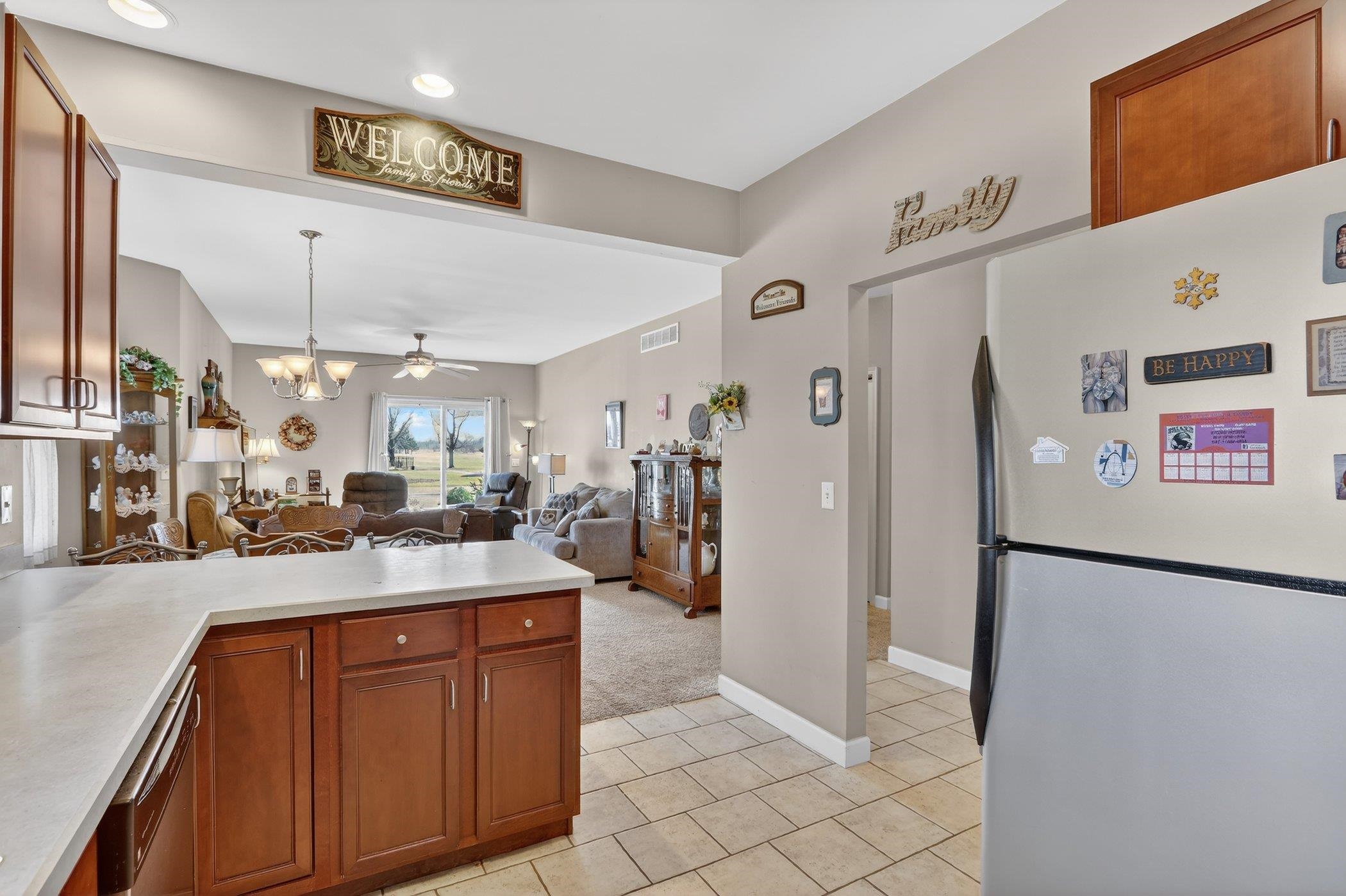 3721 Green Tree Lane DeKalb, IL 60115 - Photo 9 of 20 a kitchen with stainless steel appliances granite countertop a refrigerator and a sink