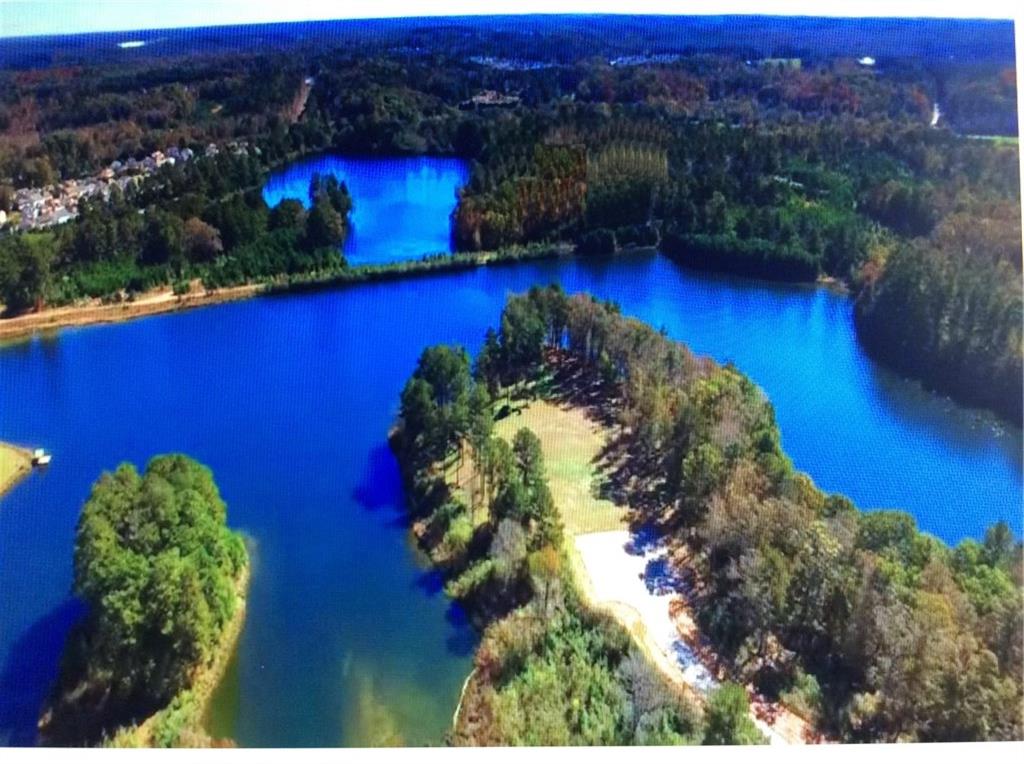 709 Giverney Way Fairburn, GA 30213 - Photo 2 of 12 a view of a house with a yard and a garden