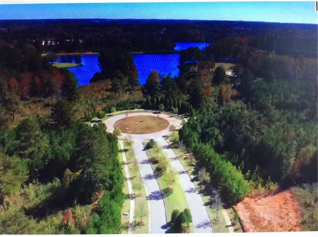 709 Giverney Way Fairburn, GA 30213 - Photo 3 of 12 a view of a house with a swimming pool and sitting area