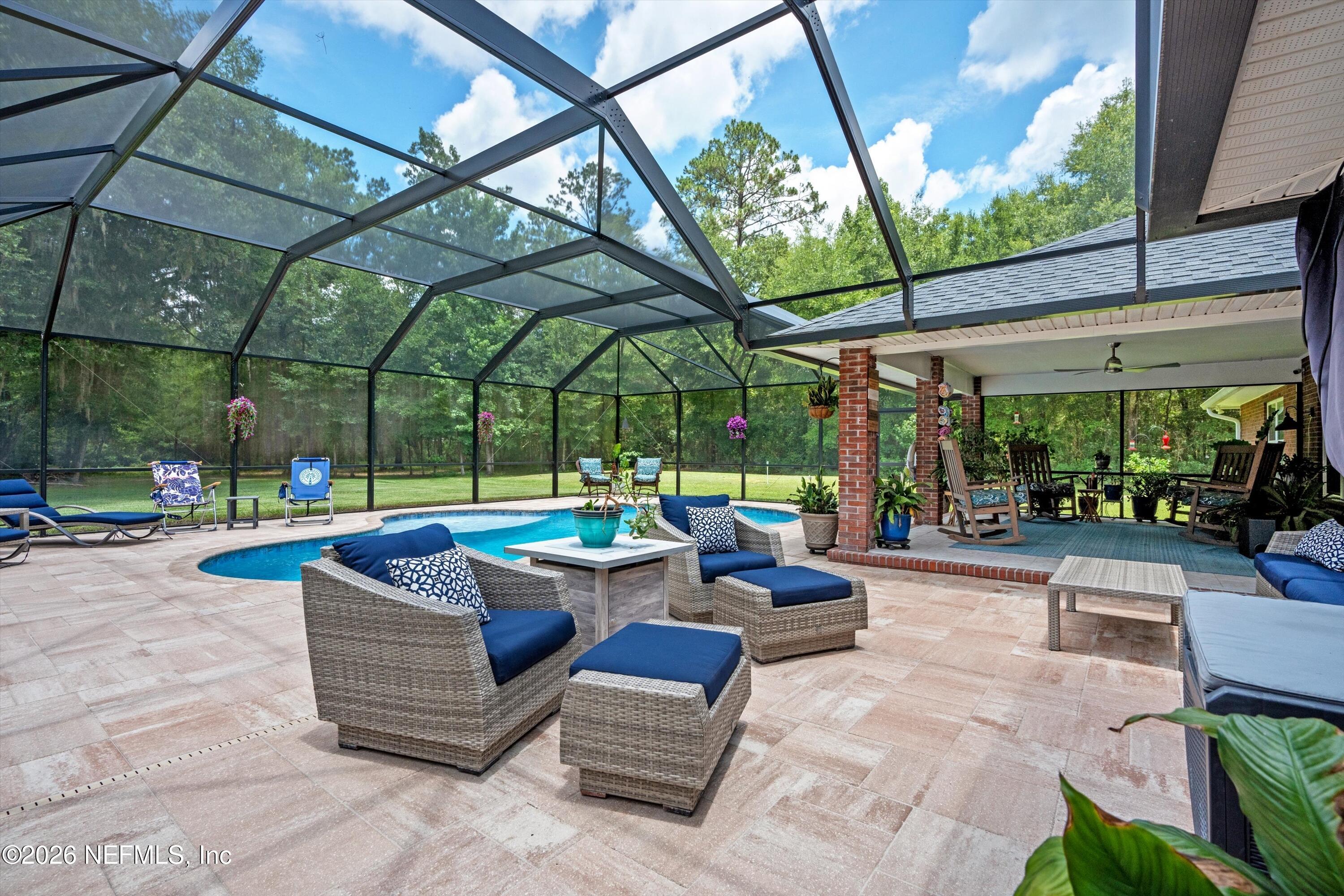 5566 Don Manuel Road Elkton, FL 32033 - Photo 39 of 47 a view of a patio with a table and chairs