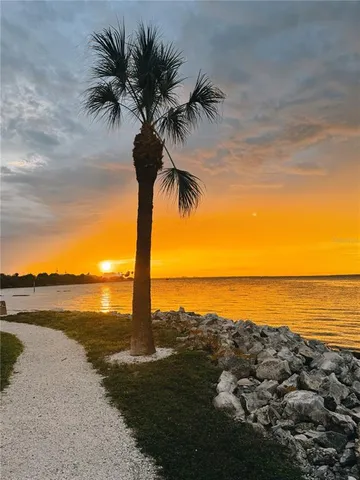 a view of a house with swimming pool and porch with furniture