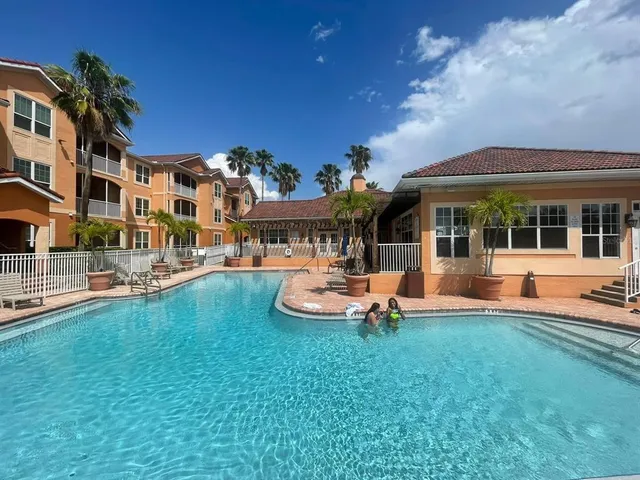 a view of a large body of water with lots of trees in the background