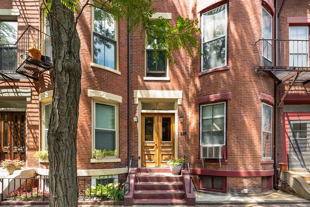 113 Chandler Street, Unit 1 Boston, MA 02116 - Photo 10 of 10 a front view of a brick house with a large windows