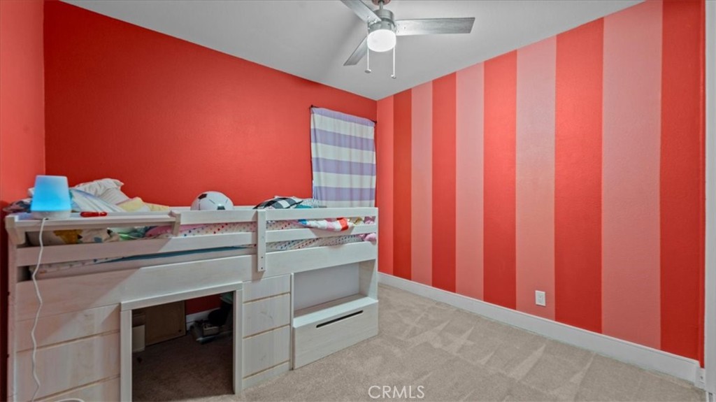 7550 Periwinkle Drive Fontana, CA 92336 - Photo 18 of 25 a view of a kitchen with stainless steel appliances granite countertop cabinets and a wooden floor