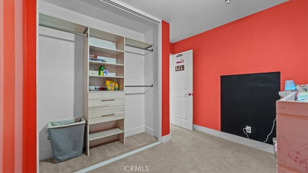 7550 Periwinkle Drive Fontana, CA 92336 - Photo 19 of 25 a view of room with walk in closet
