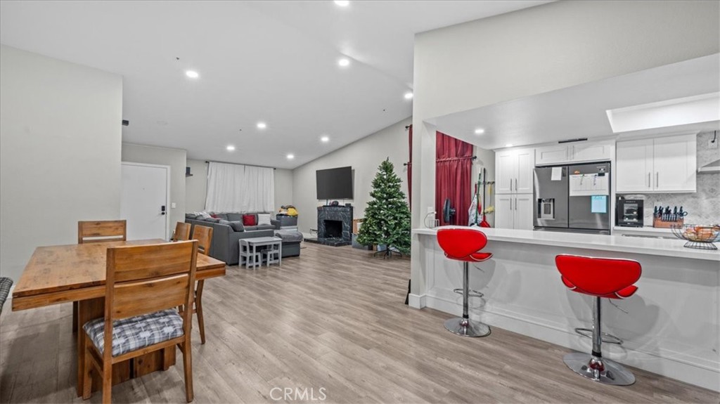 7550 Periwinkle Drive Fontana, CA 92336 - Photo 8 of 25 a living room with furniture a couch and a chandelier