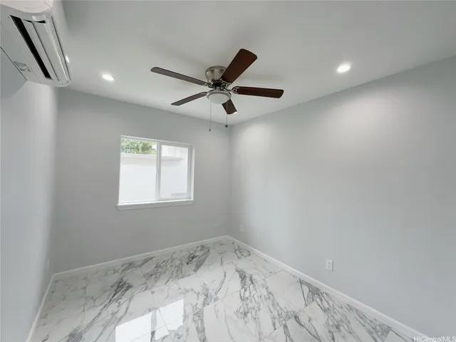 a bathroom with a toilet sink vanity and shower