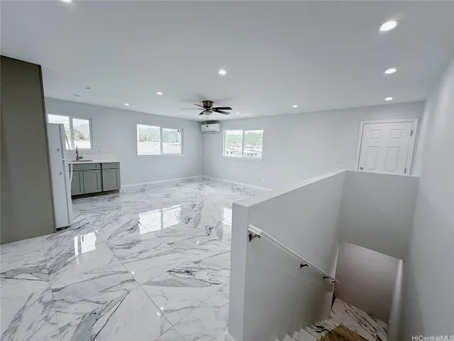 a view of a kitchen with a sink and a stove top oven