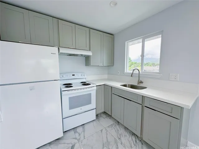 a bathroom with a shower toilet sink and mirror