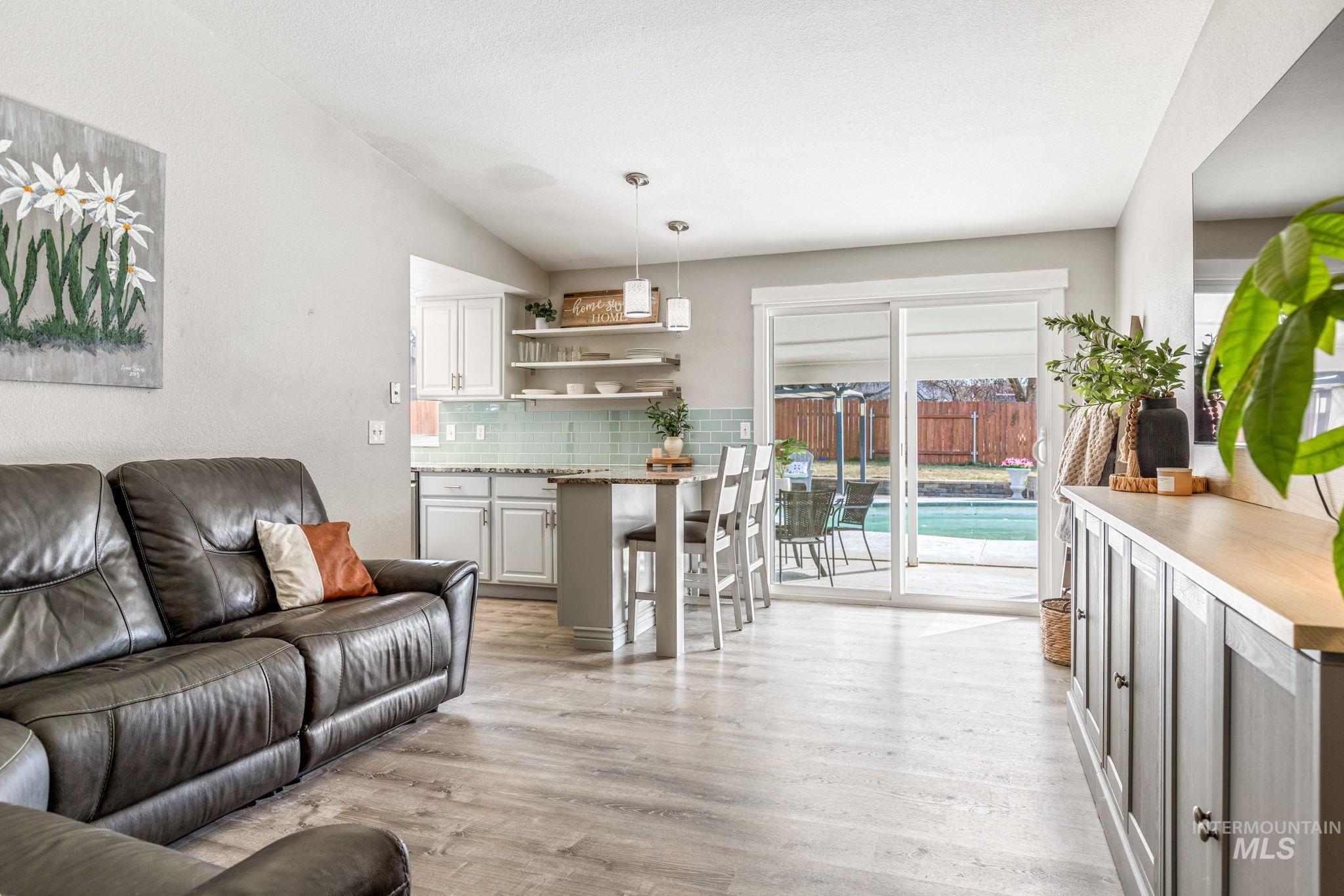 3209 Whitman Drive Boise, ID 83716 - Photo 13 of 45 Living room with light wood finished floors and lofted ceiling