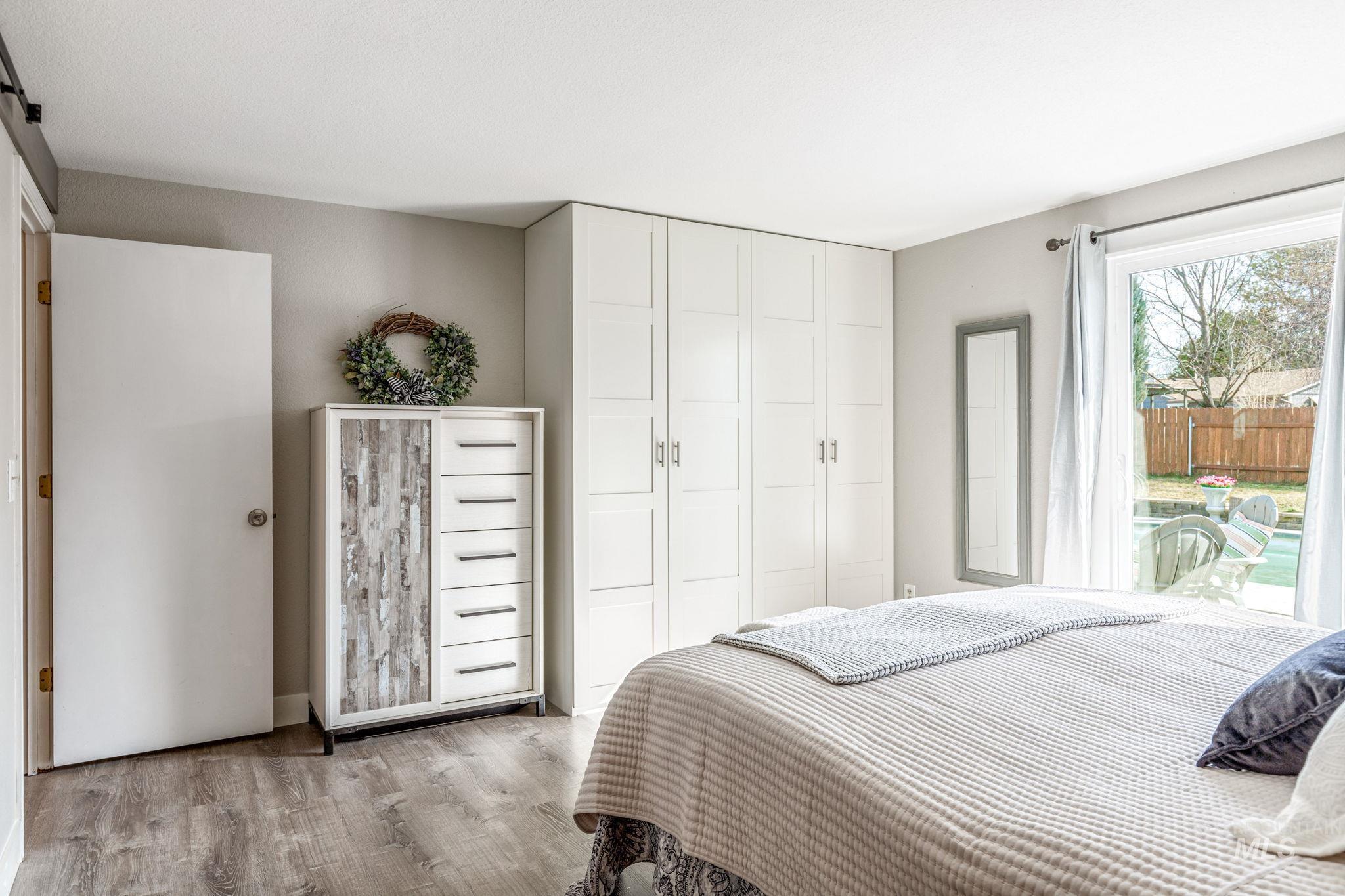 3209 Whitman Drive Boise, ID 83716 - Photo 21 of 45 Bedroom featuring wood finished floors and access to outside