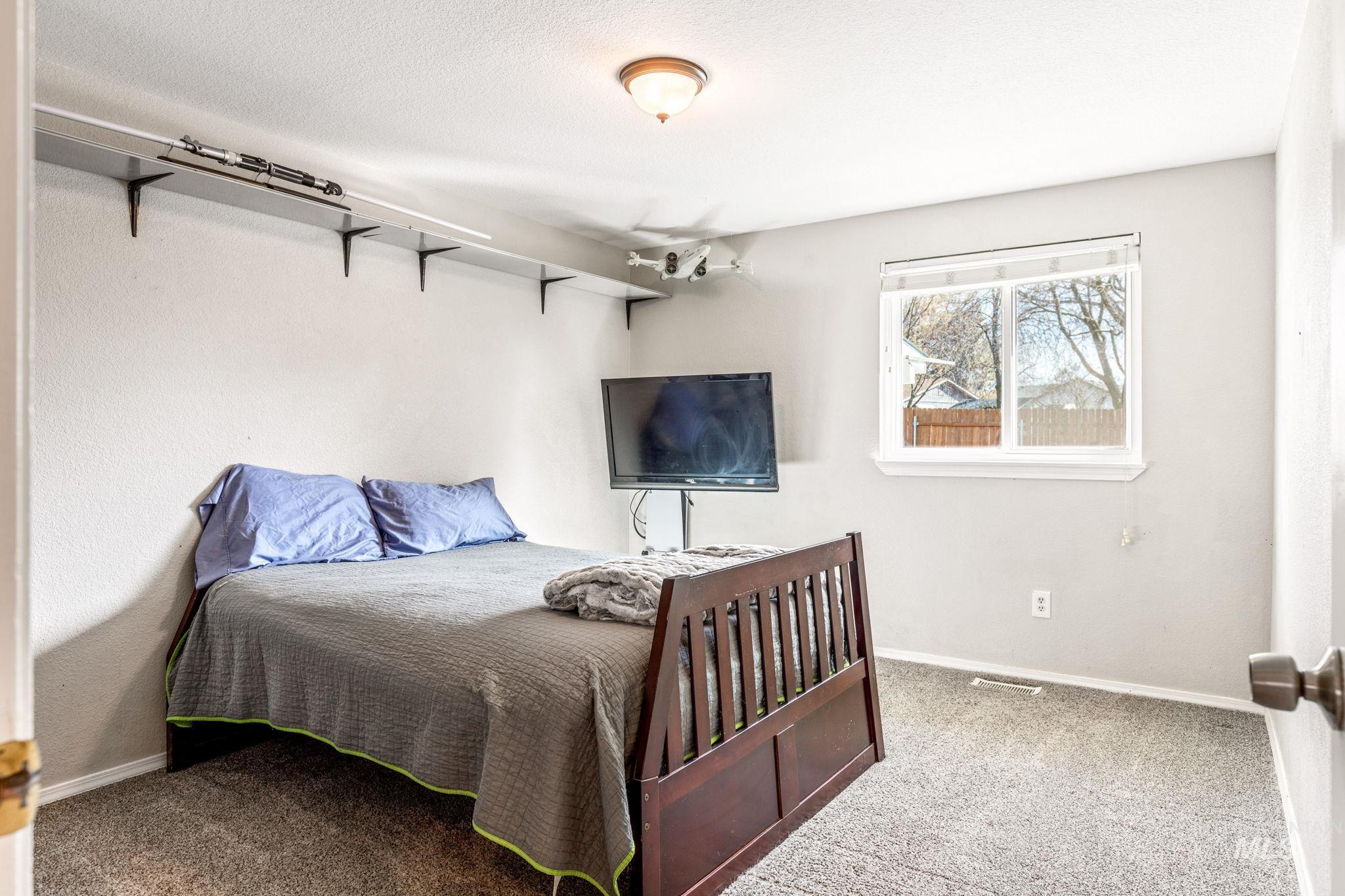 3209 Whitman Drive Boise, ID 83716 - Photo 25 of 45 Carpeted bedroom with baseboards