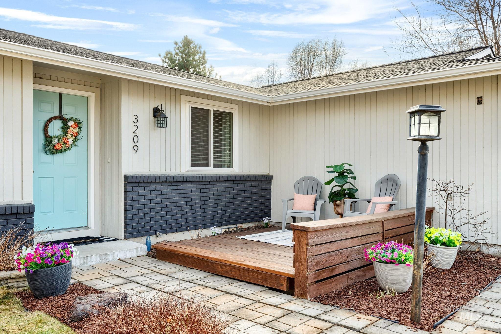 3209 Whitman Drive Boise, ID 83716 - Photo 3 of 45 Property entrance featuring roof with shingles and a deck