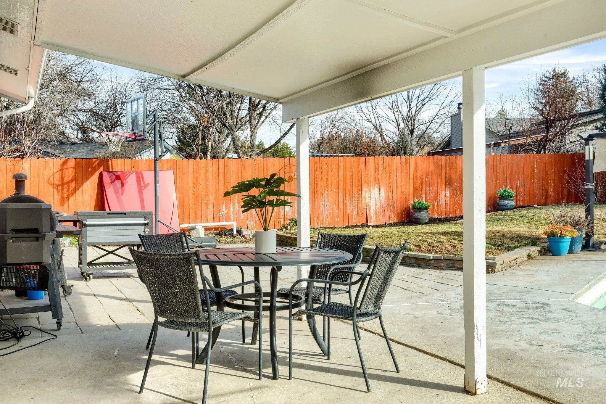 3209 Whitman Drive Boise, ID 83716 - Photo 31 of 45 Fenced backyard with outdoor dining area, a patio area, and a grill