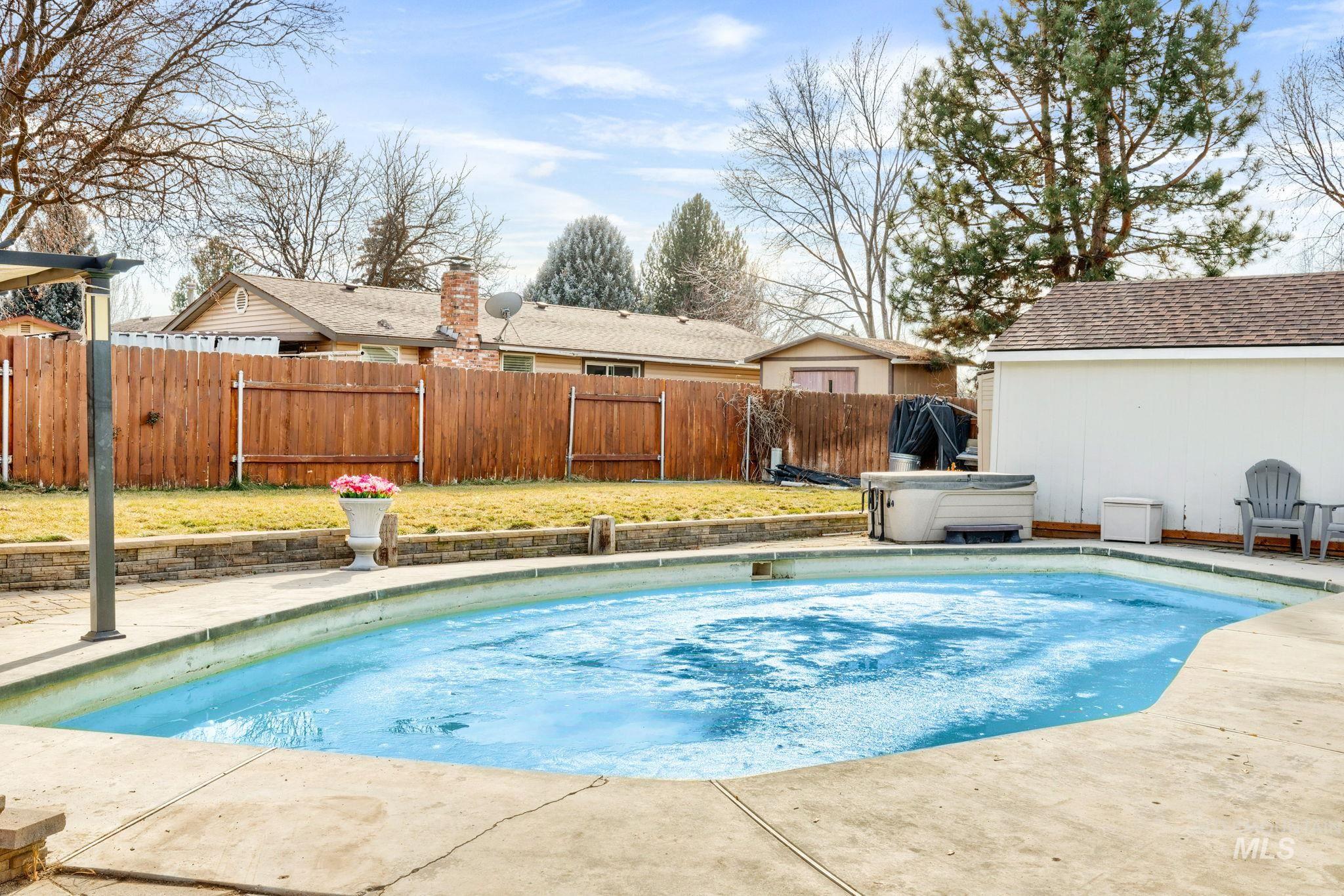 3209 Whitman Drive Boise, ID 83716 - Photo 33 of 45 View of swimming pool with patio surround and a fenced backyard