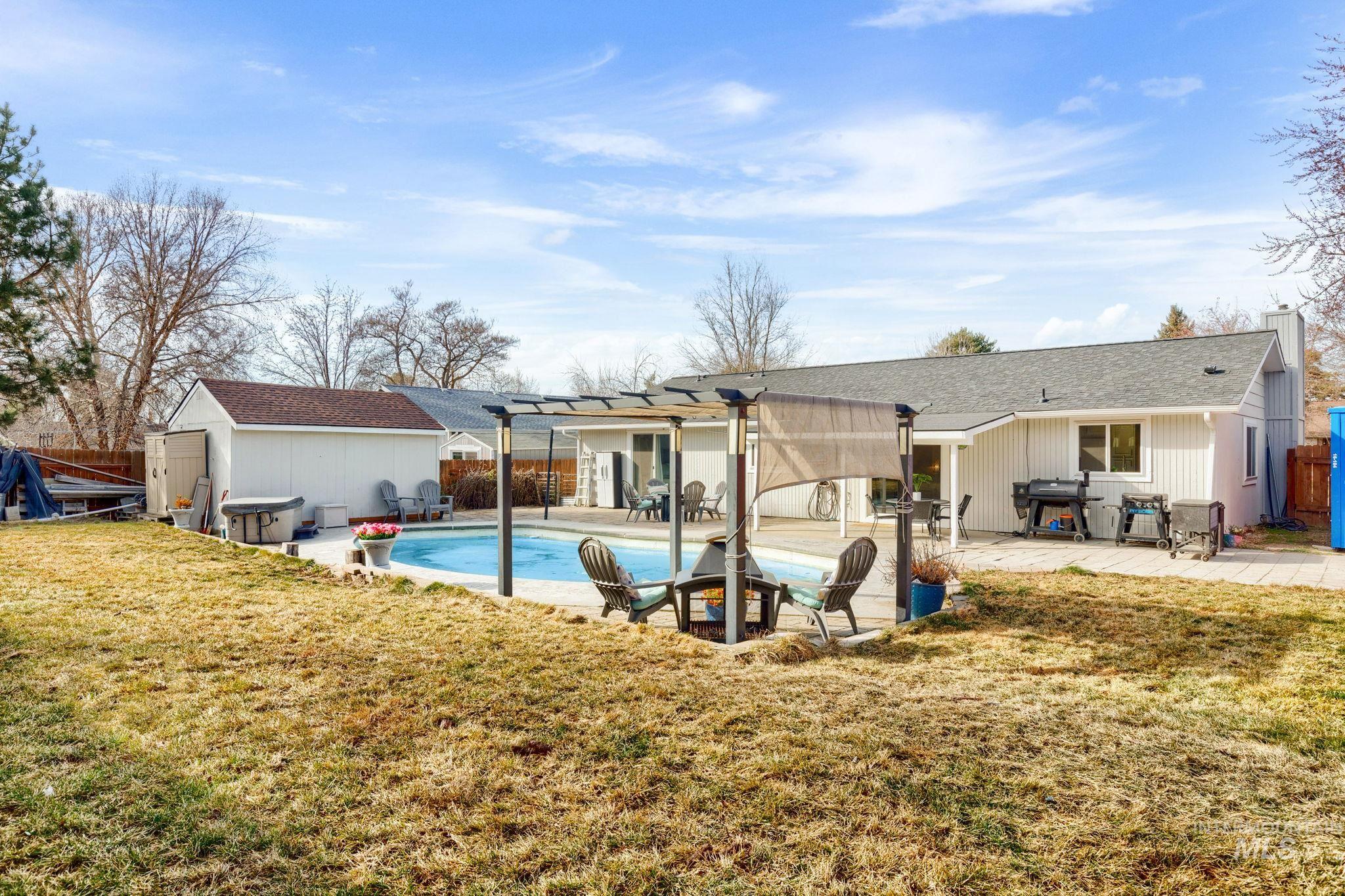 3209 Whitman Drive Boise, ID 83716 - Photo 37 of 45 Rear view of property with a patio, a fenced backyard, a pergola, and roof with shingles