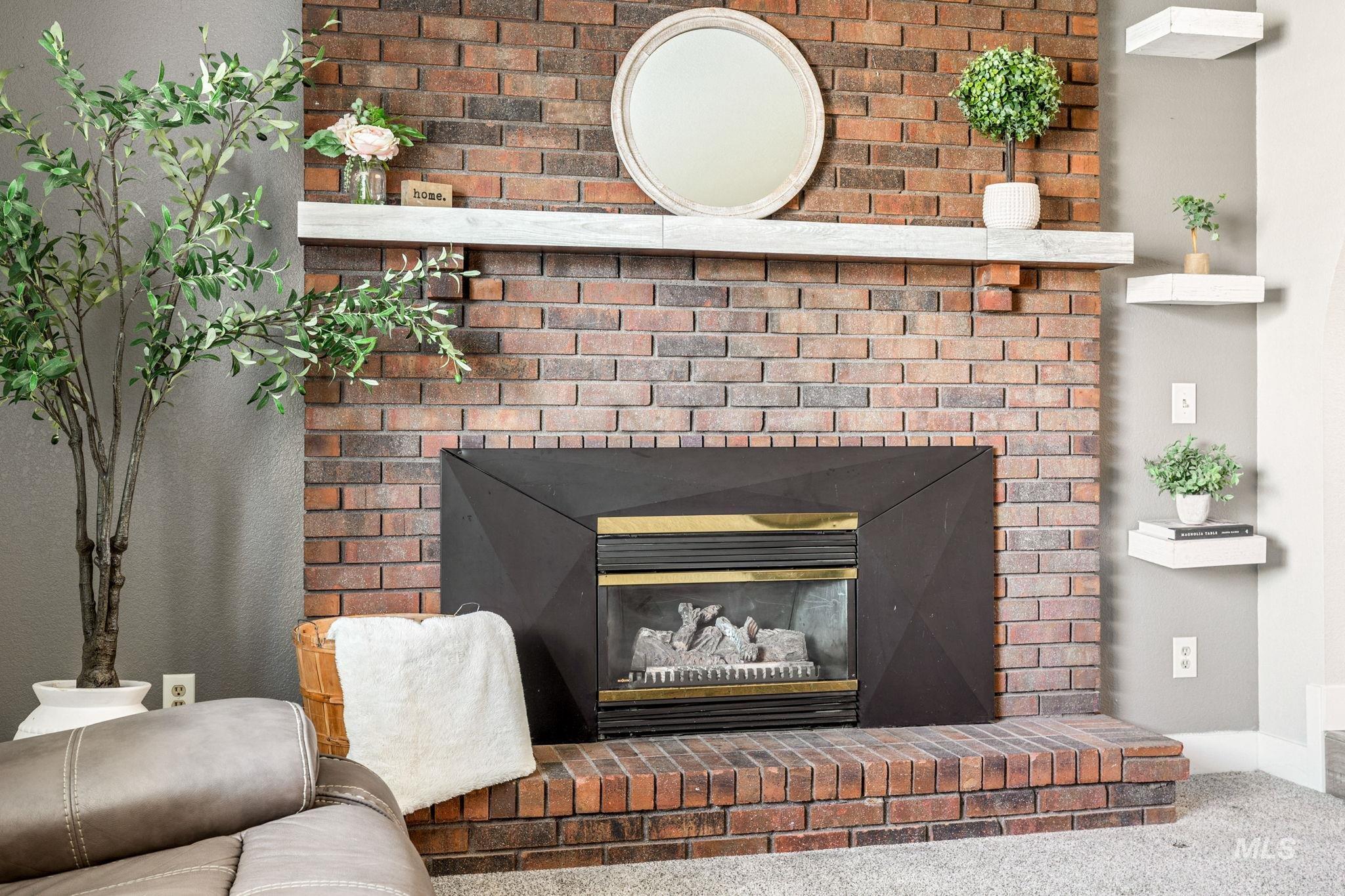 3209 Whitman Drive Boise, ID 83716 - Photo 7 of 45 Detailed view of a fireplace and carpet flooring