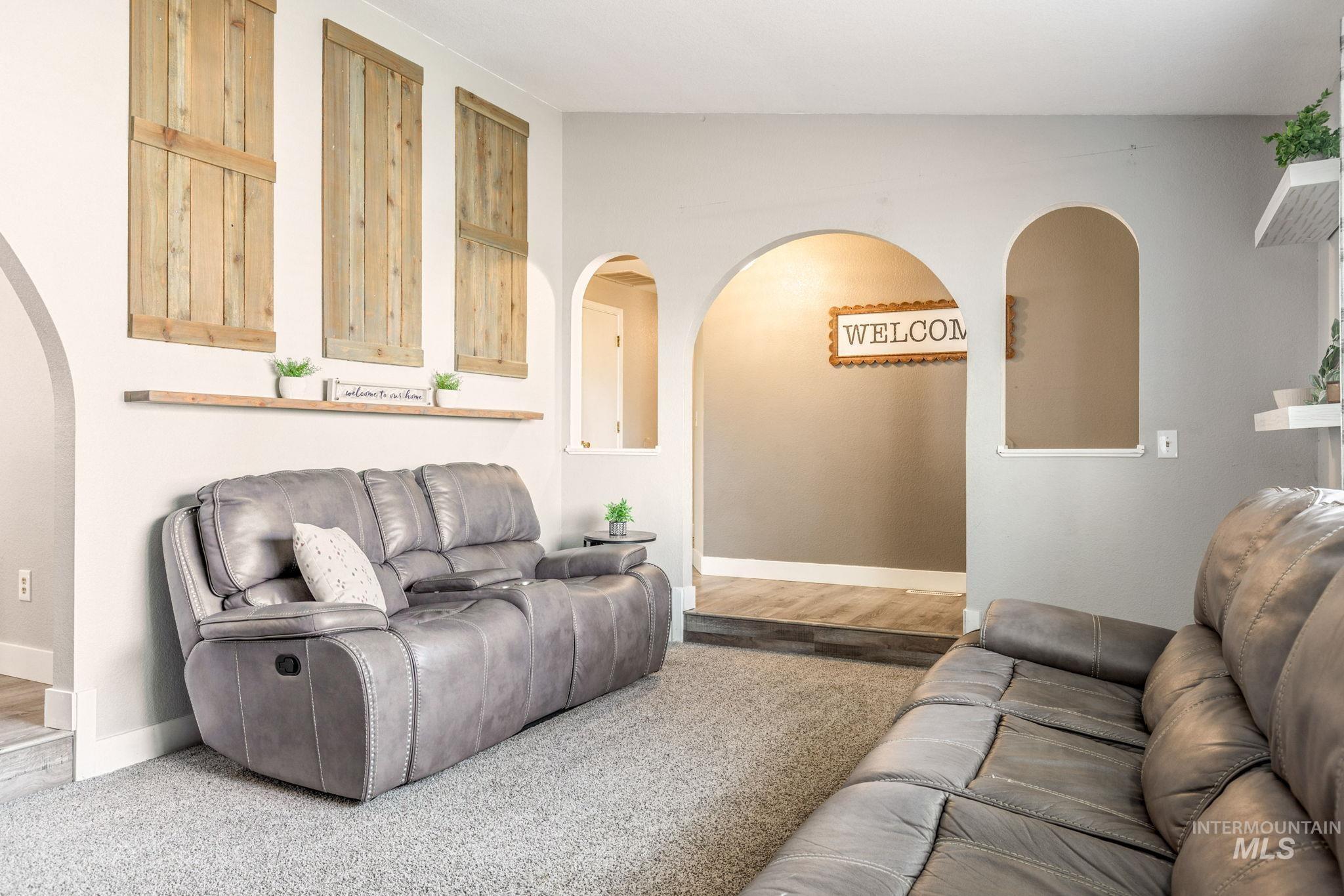 3209 Whitman Drive Boise, ID 83716 - Photo 8 of 45 Living area featuring arched walkways and wood finished floors