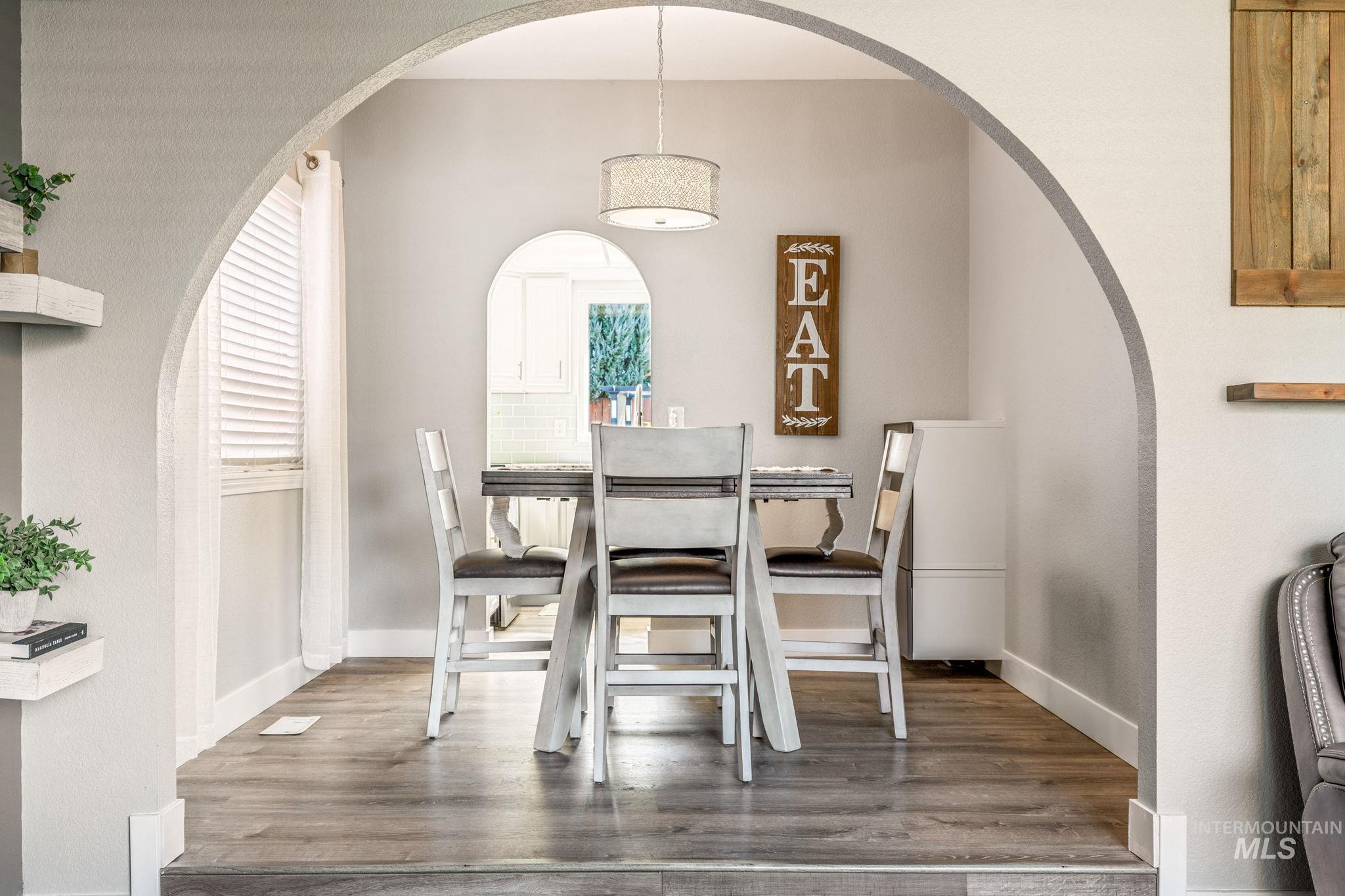 3209 Whitman Drive Boise, ID 83716 - Photo 9 of 45 Dining space featuring arched walkways and wood finished floors