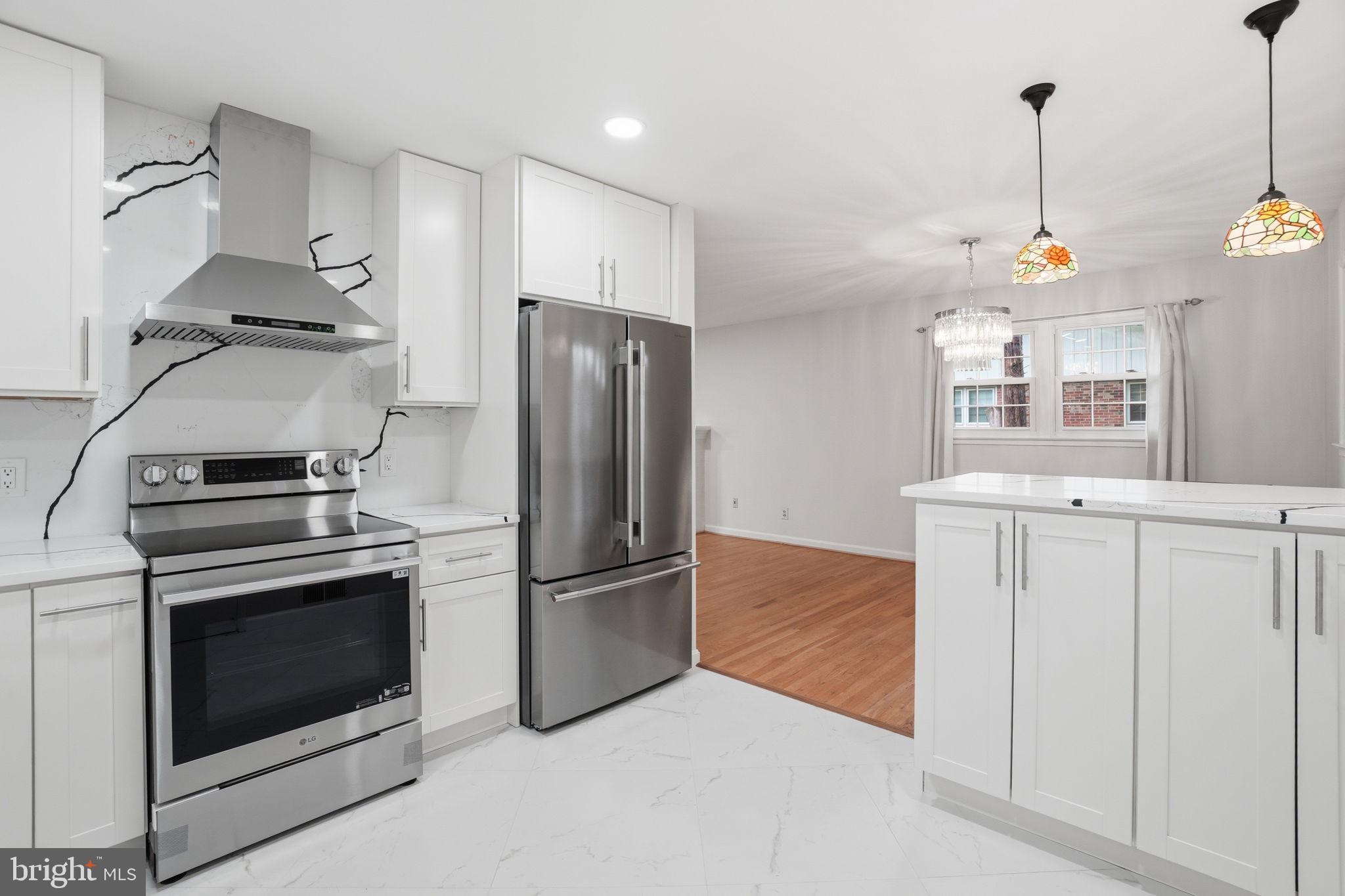 5304 Pillow Lane Springfield, VA 22151 - Photo 8 of 32 a kitchen with cabinets and stainless steel appliances