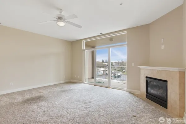 a view of an empty room with a fireplace