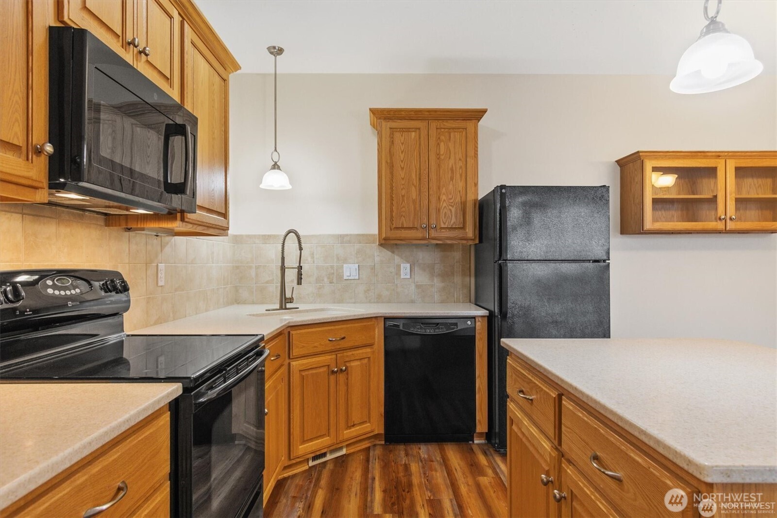1548 River Road, Unit 209 Longview, WA 98632 - Photo 10 of 24 a kitchen with stainless steel appliances granite countertop a sink stove and refrigerator