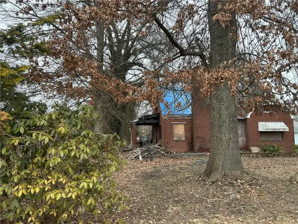 a view of house with trees in the background