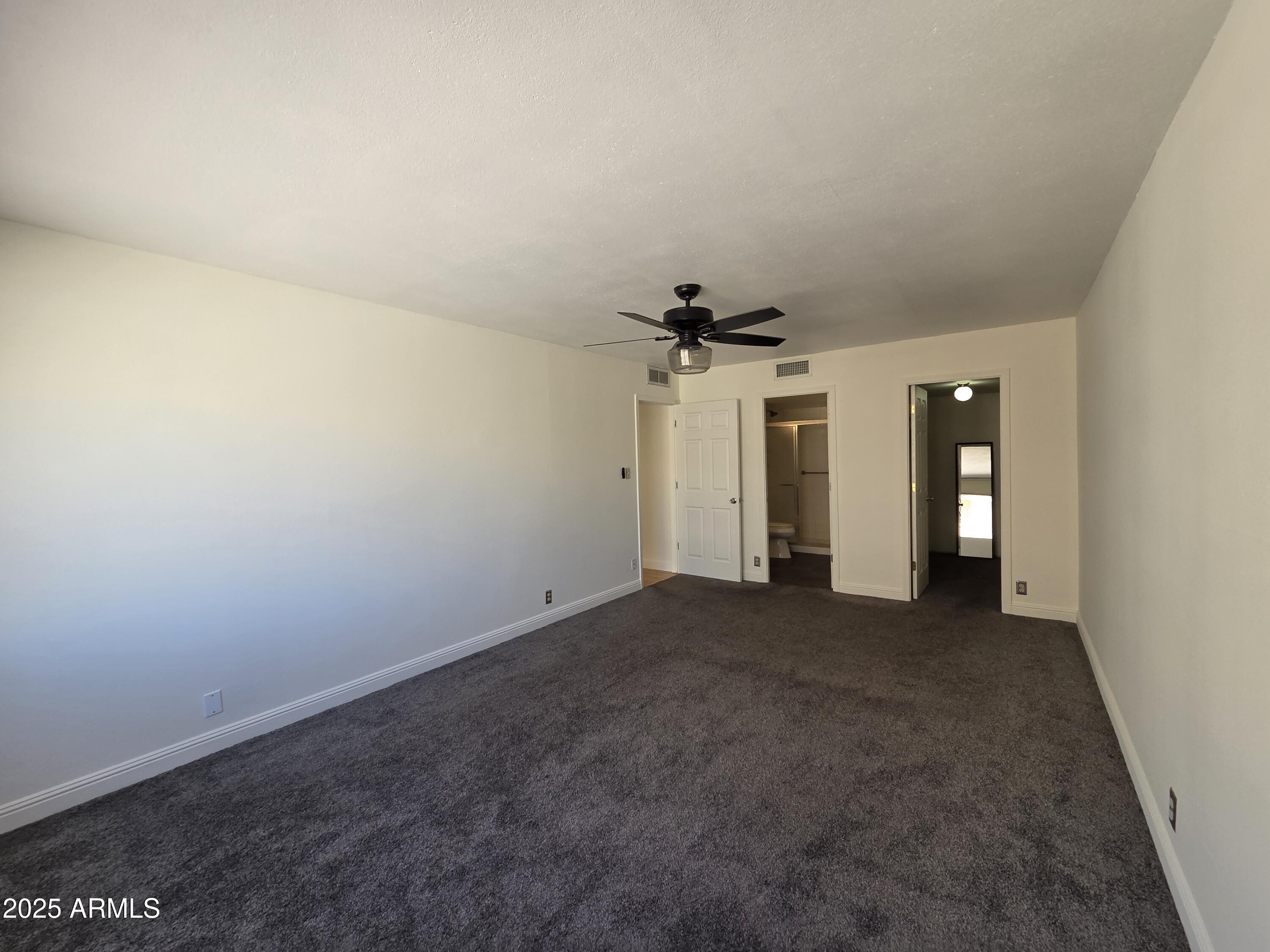 7920 East Camelback Road, Unit 408 Scottsdale, AZ 85251 - Photo 15 of 18 wooden floor in an empty room