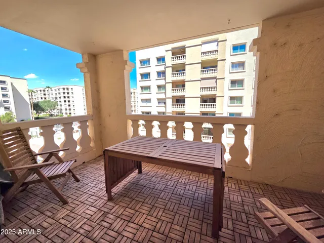 a wooden bench sitting in front of a window