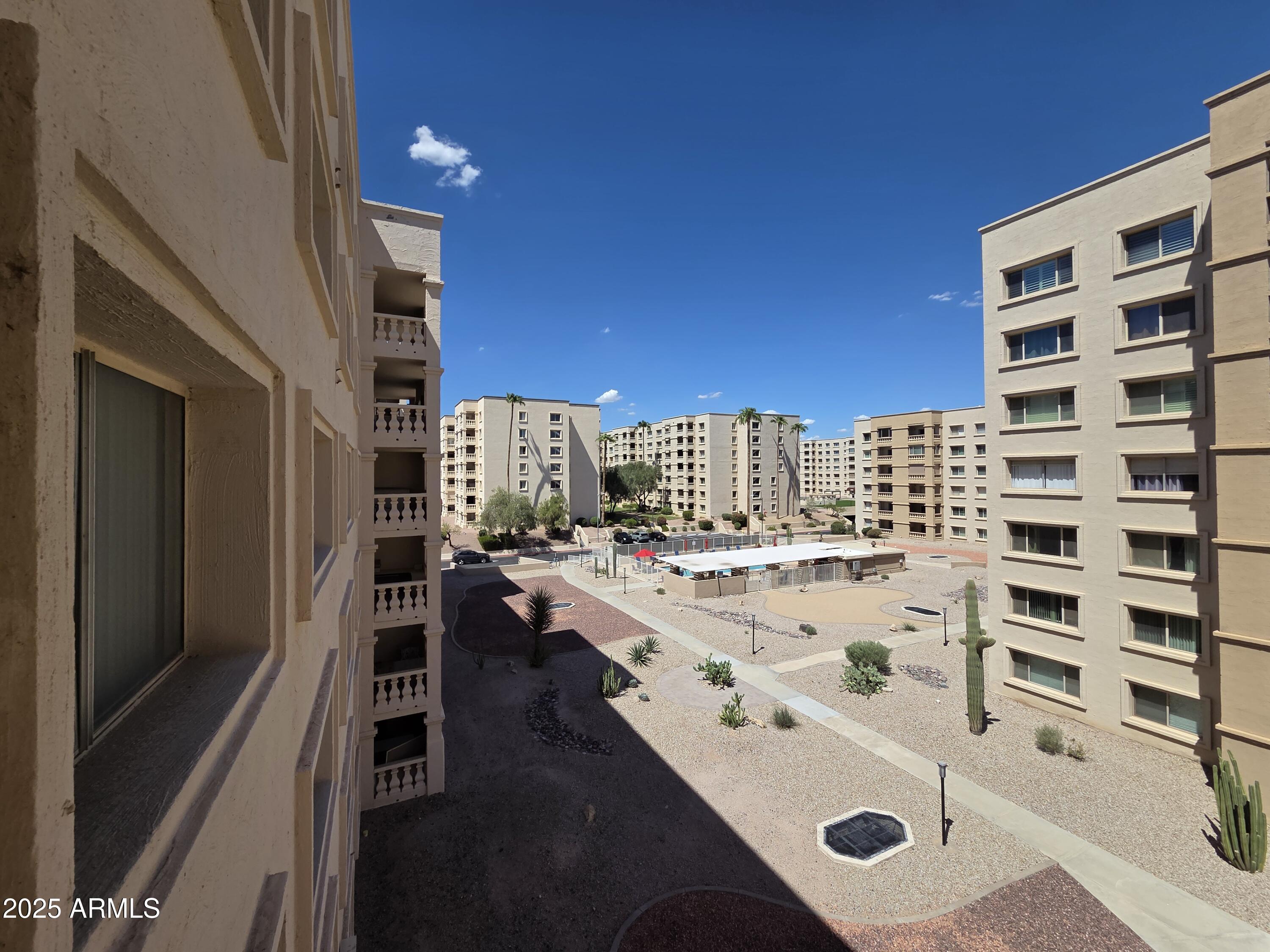7920 East Camelback Road, Unit 408 Scottsdale, AZ 85251 - Photo 6 of 18 a view of open kitchen with utility and utility room