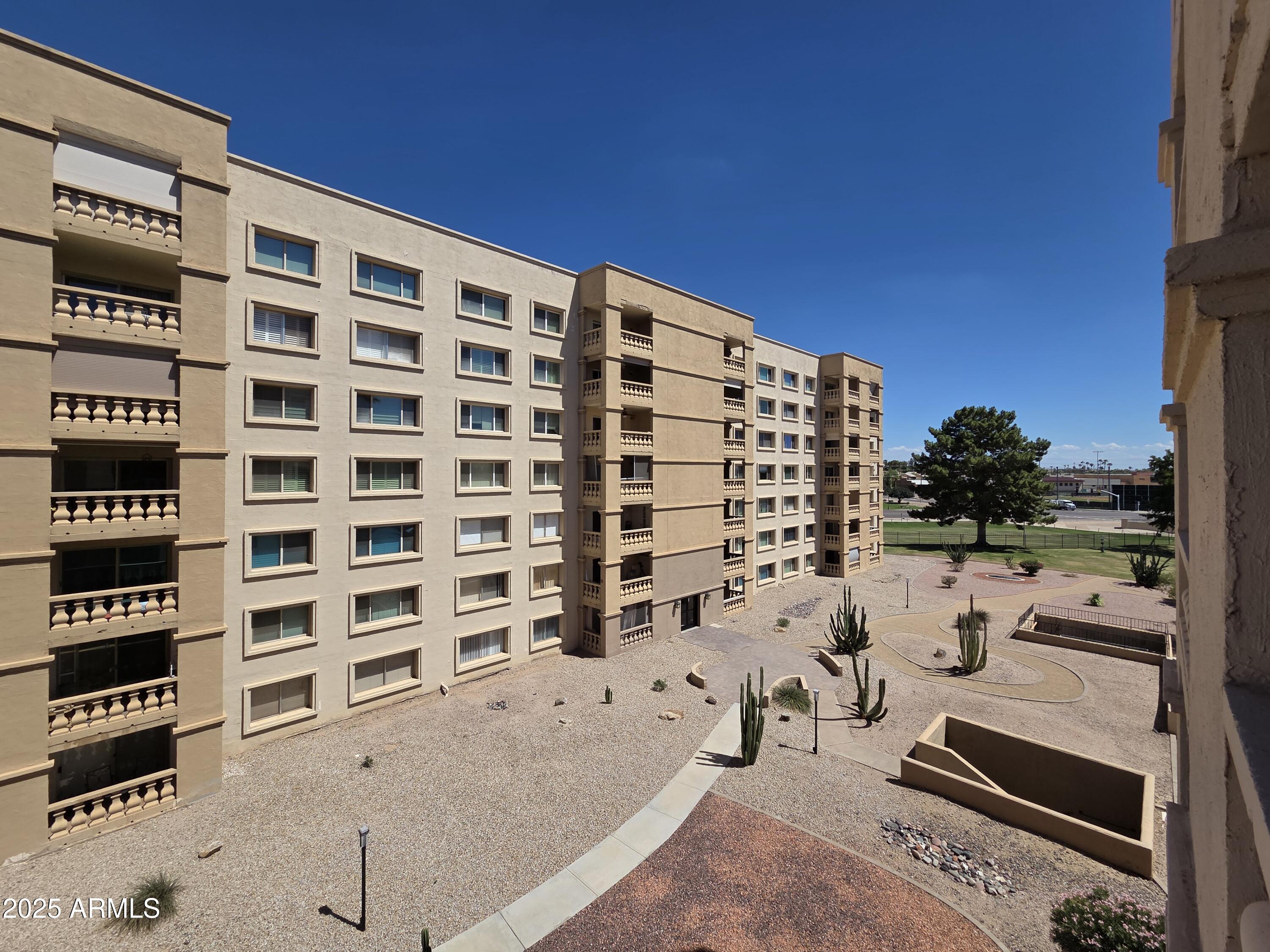 7920 East Camelback Road, Unit 408 Scottsdale, AZ 85251 - Photo 7 of 18 view of building with outdoor space