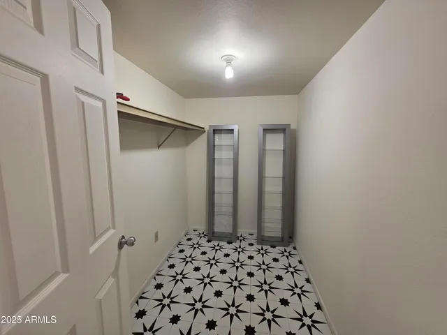 a bathroom with a toilet sink and shower