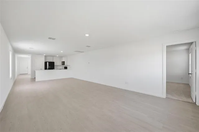 a kitchen with a stove and a refrigerator