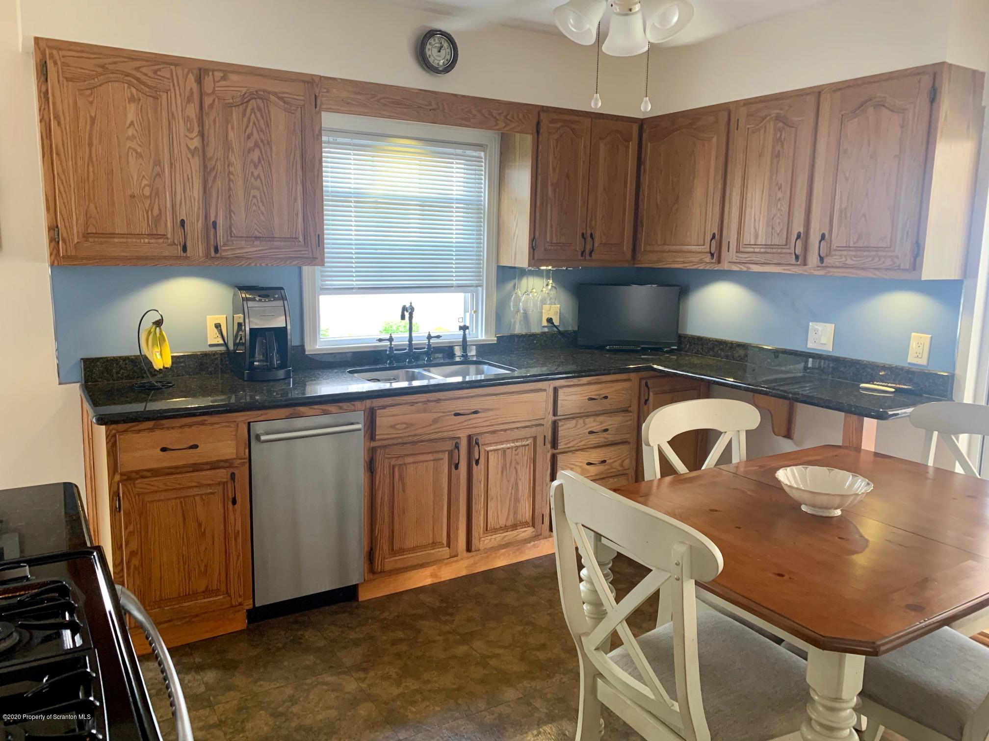 1094 Rutter Avenue Kingston, PA 18704 - Photo 13 of 35 a kitchen with a sink a stove and cabinets