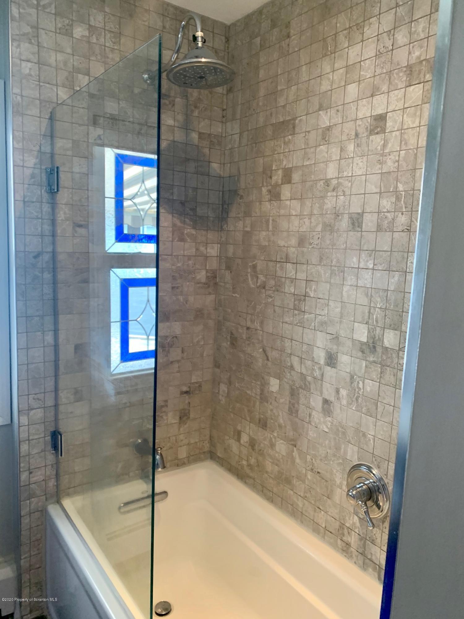 1094 Rutter Avenue Kingston, PA 18704 - Photo 15 of 35 a bathroom with a bathtub and shower