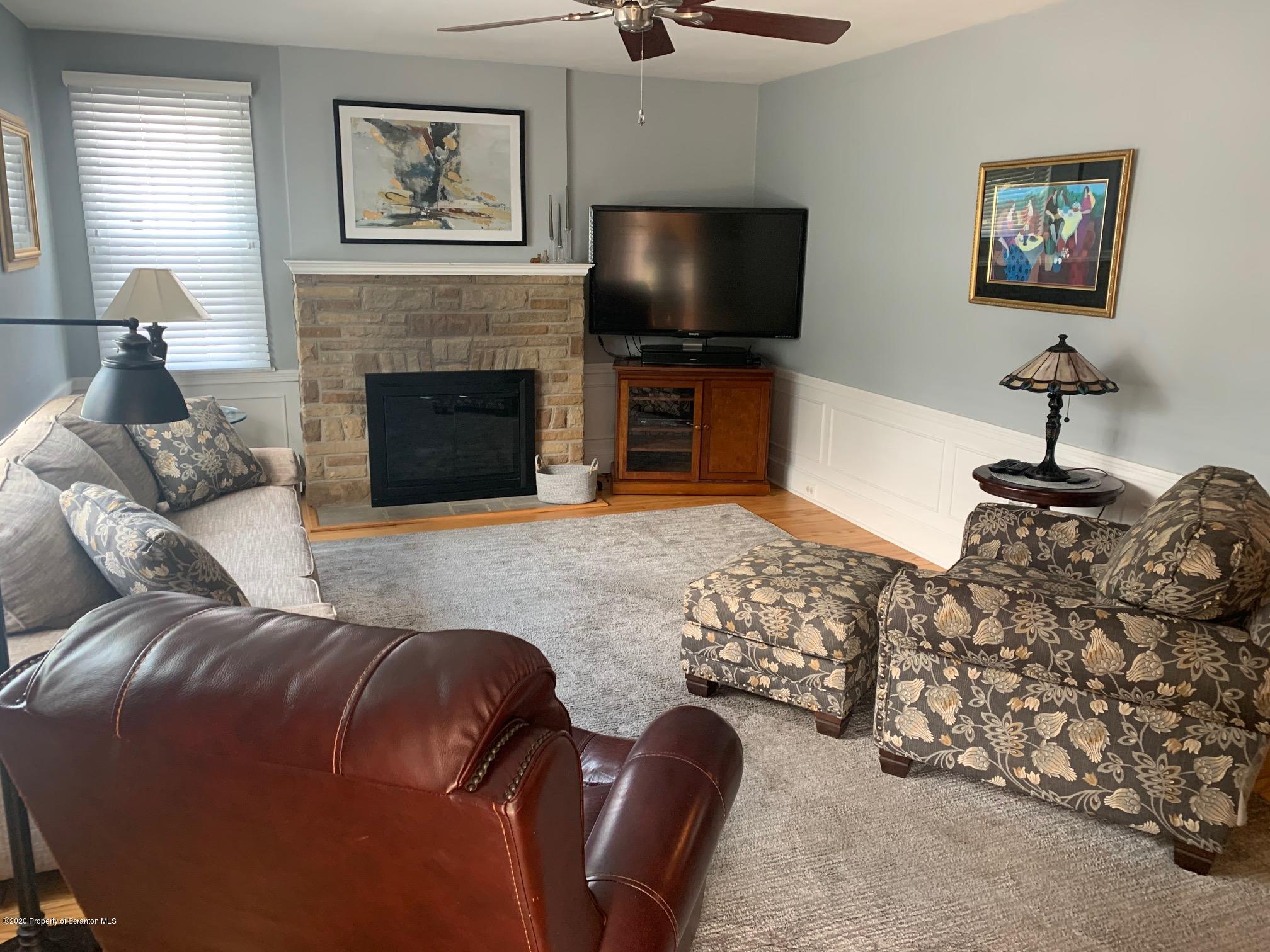 1094 Rutter Avenue Kingston, PA 18704 - Photo 2 of 35 a living room with furniture and a flat screen tv