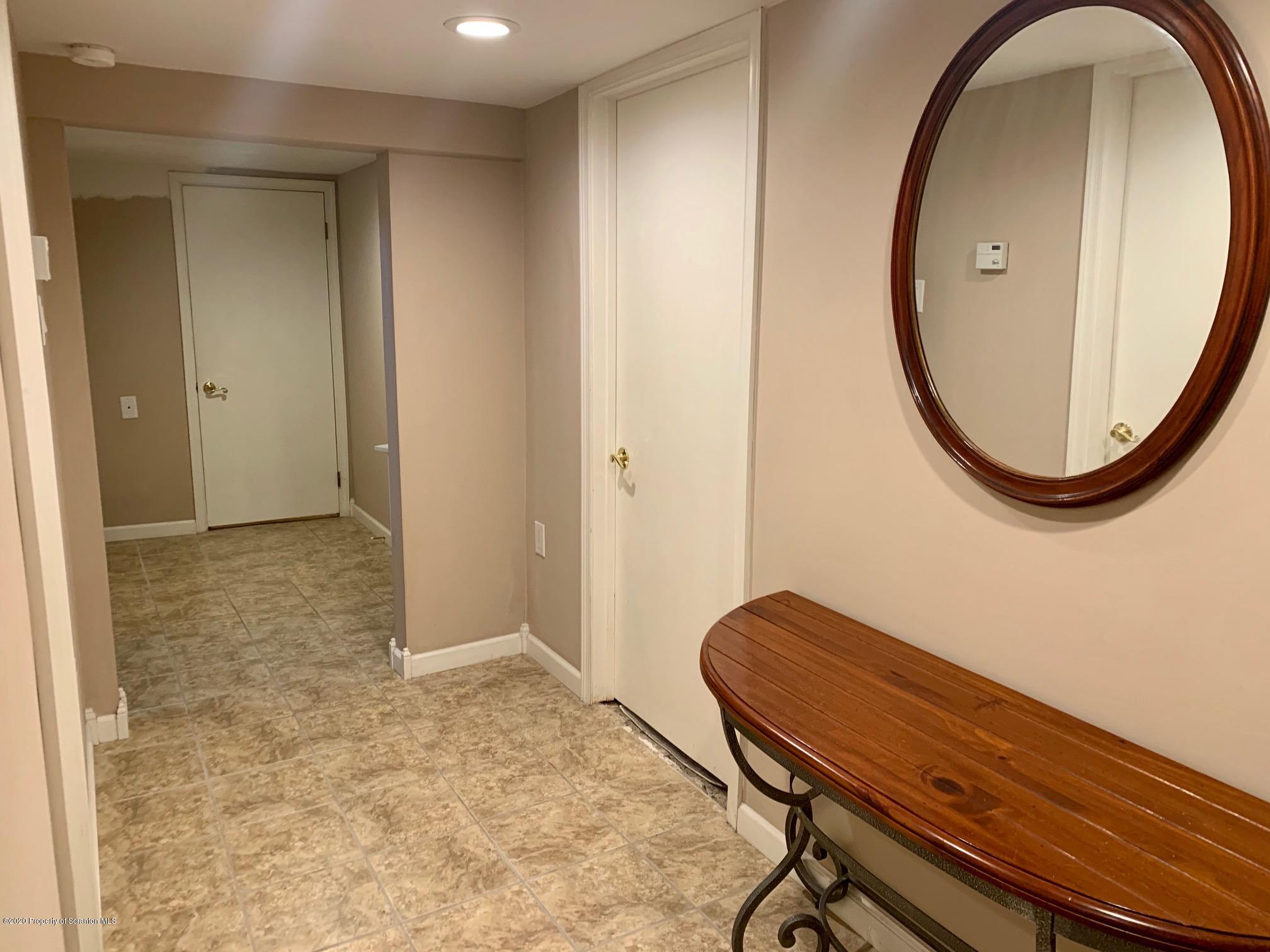 1094 Rutter Avenue Kingston, PA 18704 - Photo 23 of 35 a view of a room with a mirror and a fan