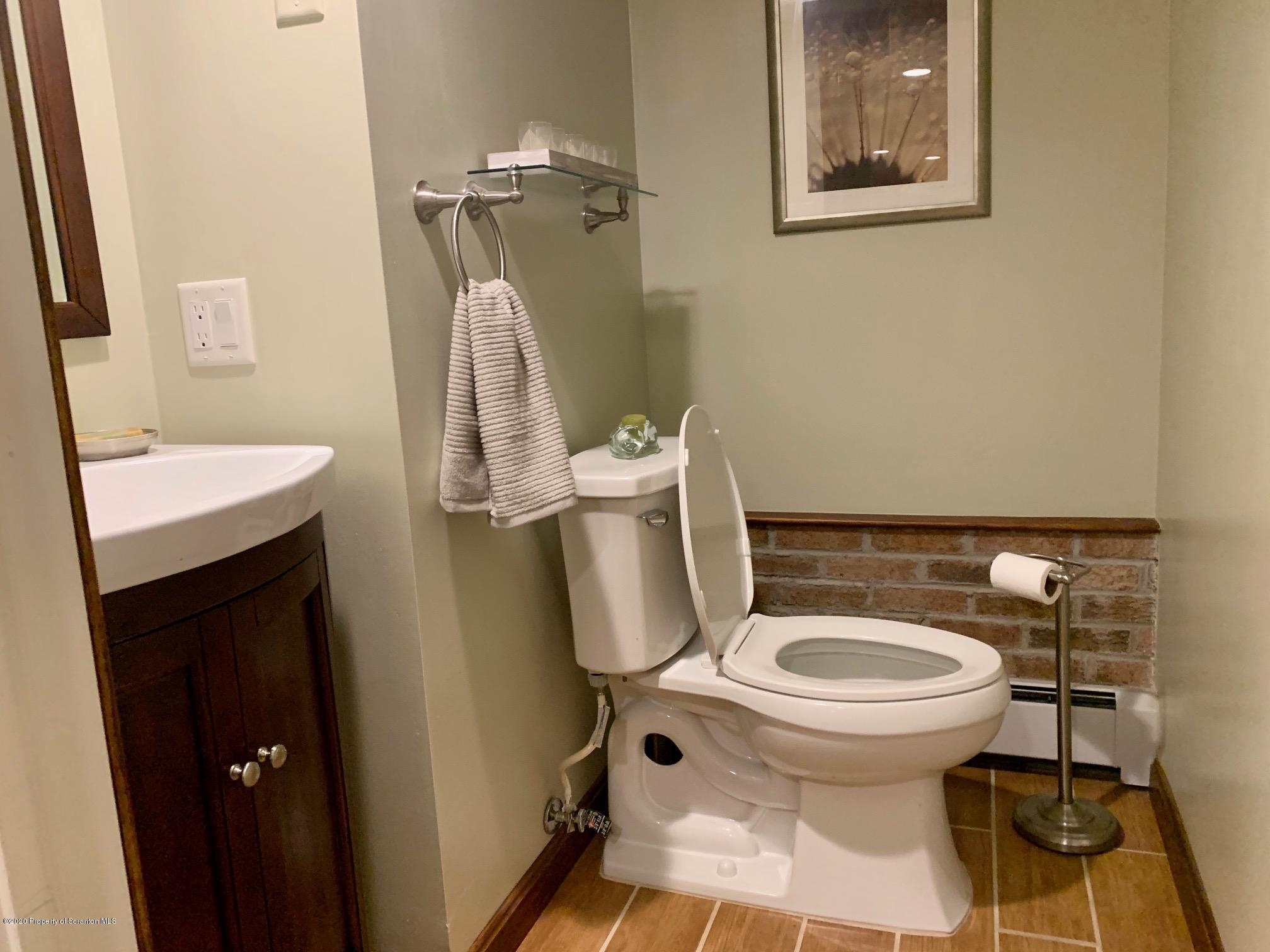 1094 Rutter Avenue Kingston, PA 18704 - Photo 27 of 35 a bathroom with a toilet and a sink