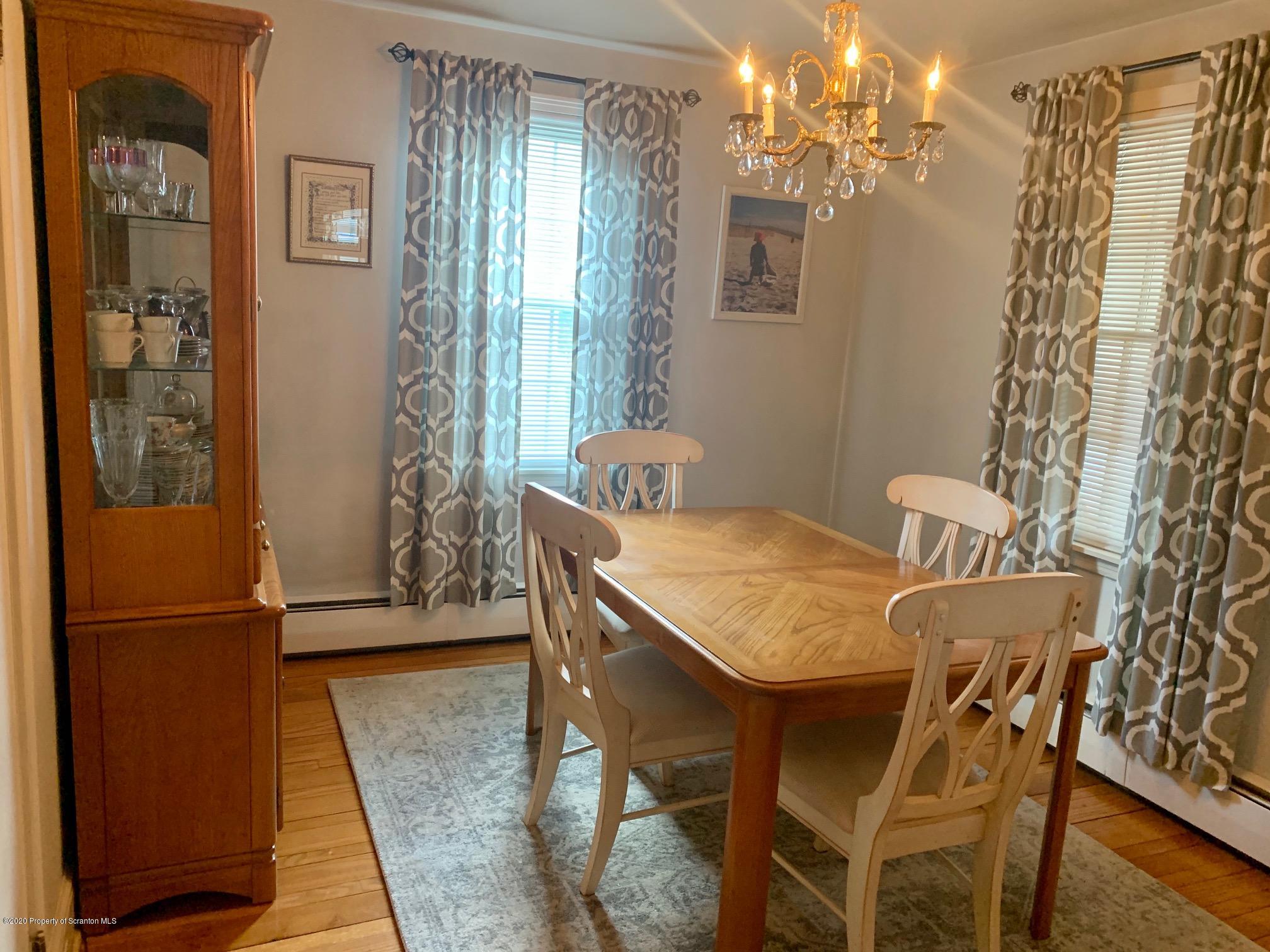 1094 Rutter Avenue Kingston, PA 18704 - Photo 8 of 35 a view of a dining room with furniture and chandelier