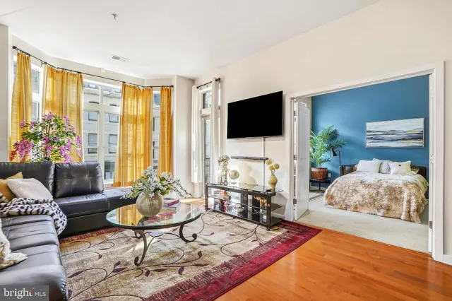 a living room with furniture and a flat screen tv